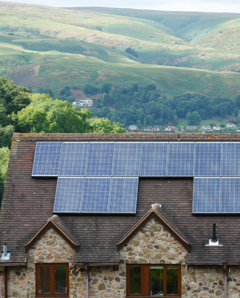 Solar panels fitted to the roof of a house in rural England.